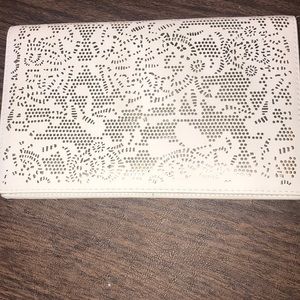 White and gold laser cut leather clutch with strap